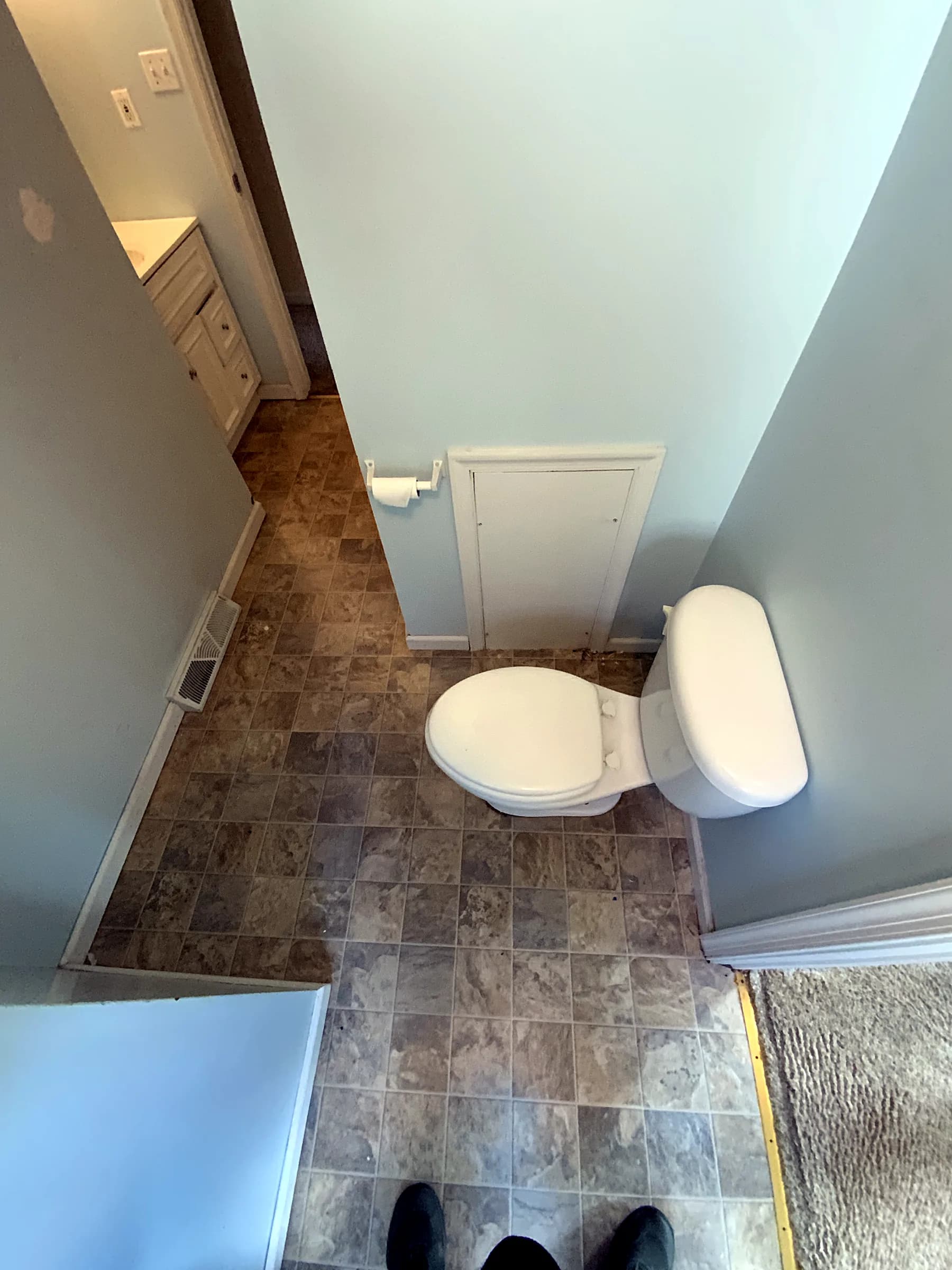 Bathroom reno: marble tub & navy vanity before