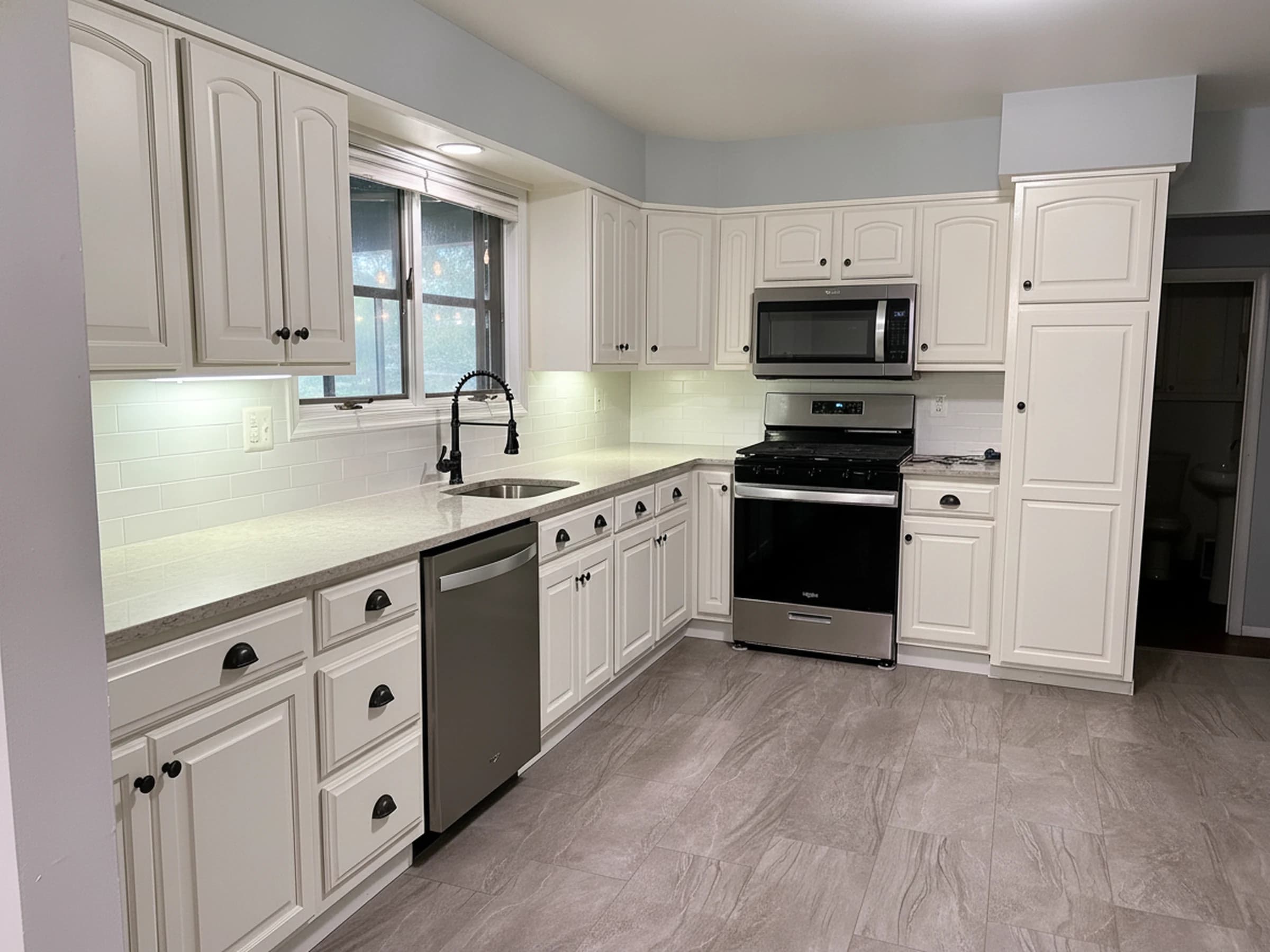 Dated kitchen, brightened to warm white after